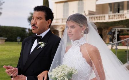 Lionel Richie walks Sofia down the aisle.